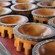 A table of decoratively carved wooden bowls